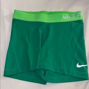 Green Nike Pro shorts